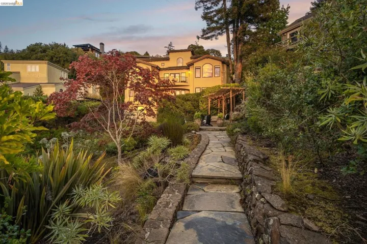 View of home's community featuring a pergola and a patio area