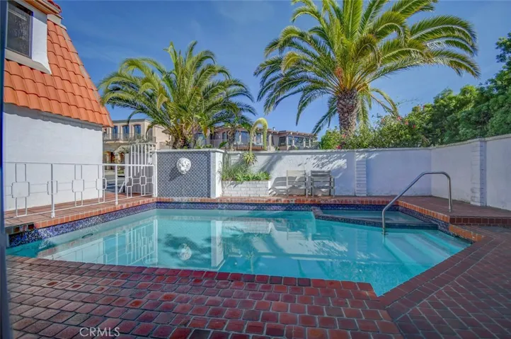 Looking out the windows to the front of the home where the pool and spa are located.