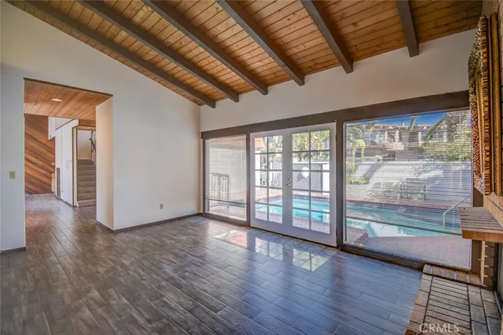 Here is another view of the family room looking out to the pool area in the front of the property.