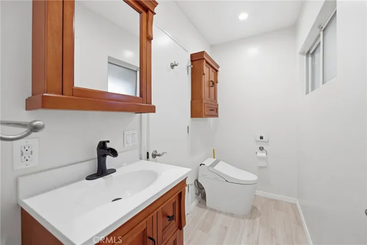 Hall bathroom has access from laundry and front hall