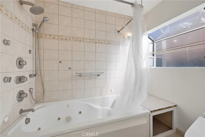 Main bathroom has soakikng tub, garden window
