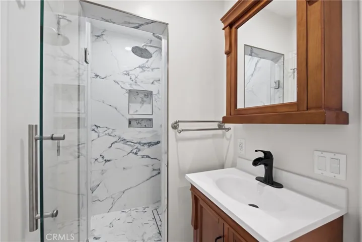 Custom porcelain tile shower with linear drain