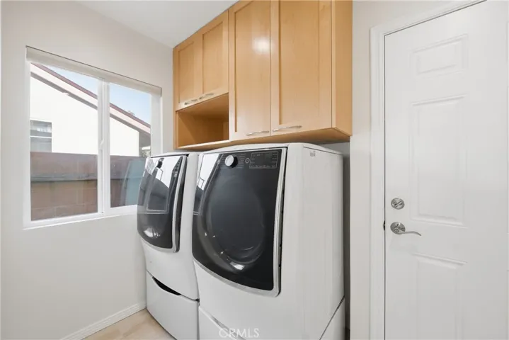 Laundry room with LG twin washer and steam gas dryer included