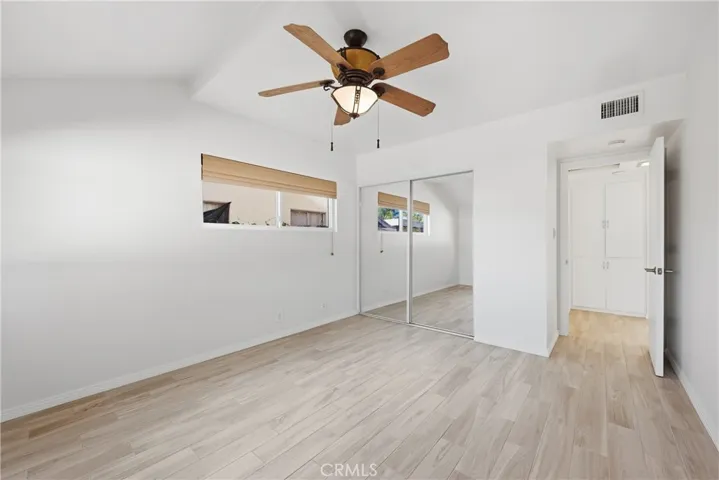 Bedroom #2 has ceiling fan and mirrored closet door