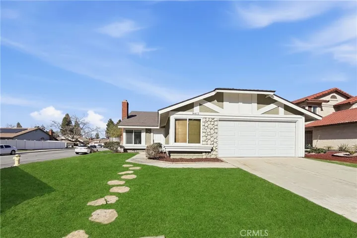 Front of home with AI generated image of what the front lawn can look like.