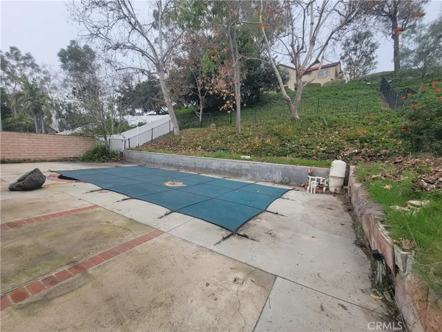 Large backyard with in-ground pool.