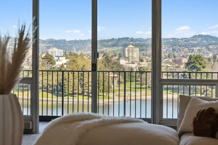 Bedroom featuring multiple windows and a mountain view