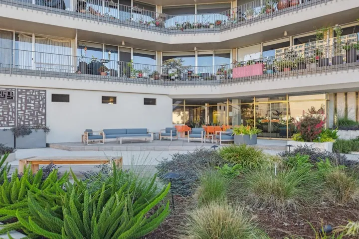 View of community with outdoor lounge area and a patio area