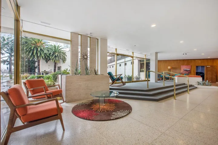 Community lobby with recessed lighting and wooden walls