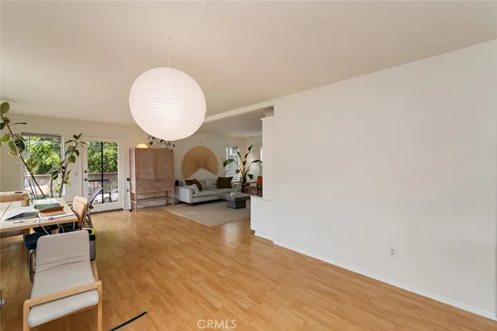 Dining area leading to back balcony.