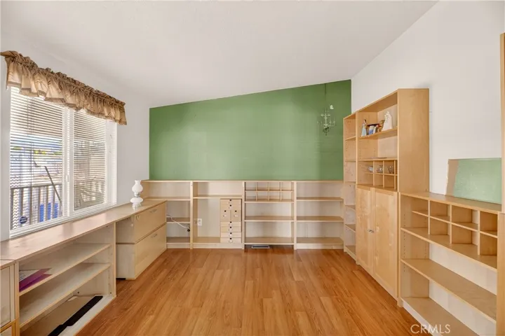 Office with custom office cabinets and bookshelves.