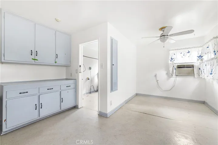 Kitchen cabinets and Dinette area to the right.
