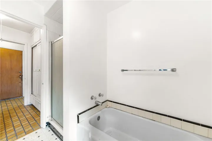 Full bath with separte tub and shower stall.