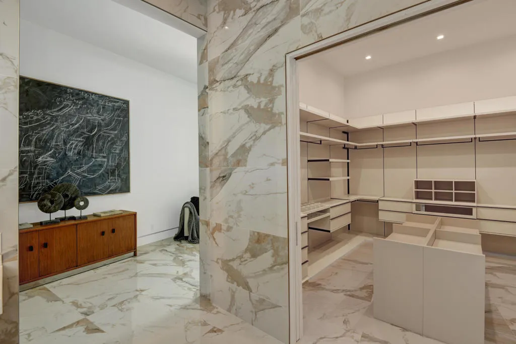 PRIMARY WALK IN CLOSET TO ENTRY HALL