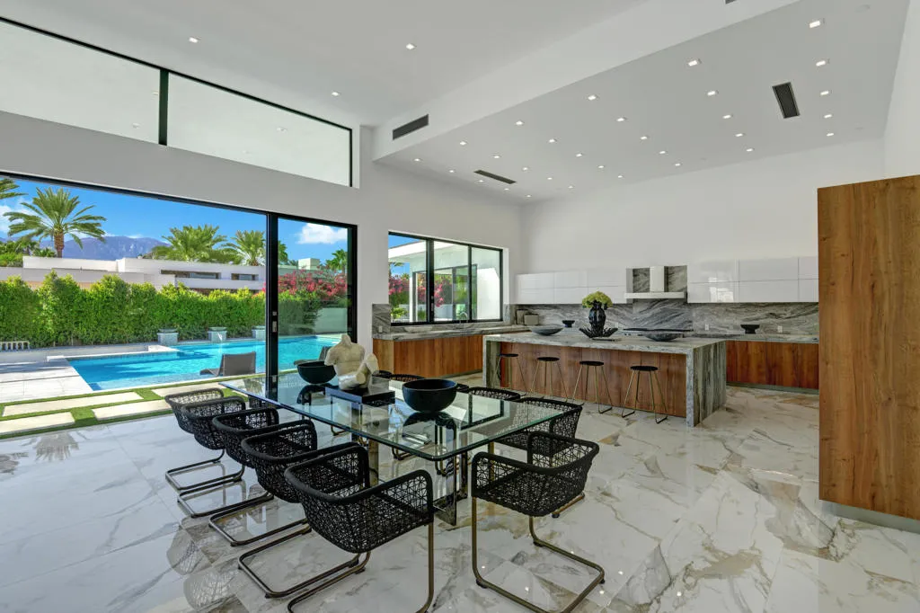 DINING ROOM TO KITCHEN POOL AND MOUNTAIN