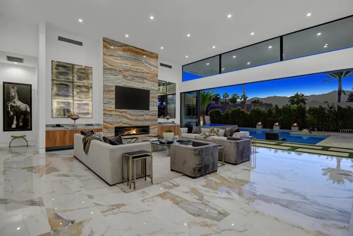 LIVING ROOM TO POOL AND MOUNTAINS NIGHT