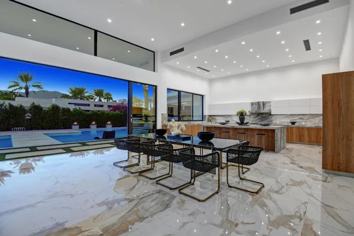 DINING ROOM TO KITCHEN AND POOL NIGHT