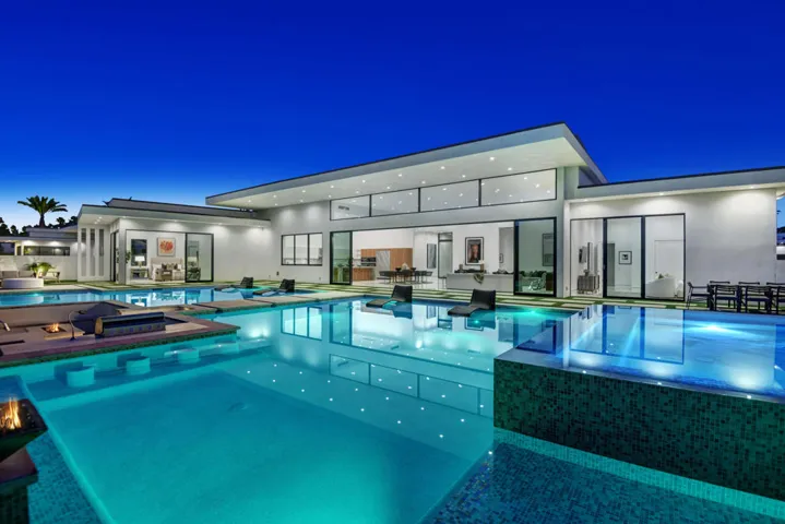 POOL AND SPA ANGLED TO HOUSE NIGHT