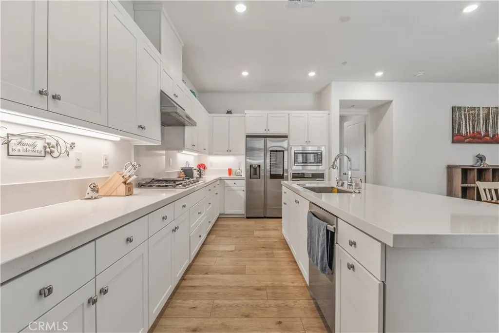 Kitchen with all stainless steel appliances, including smart fridge