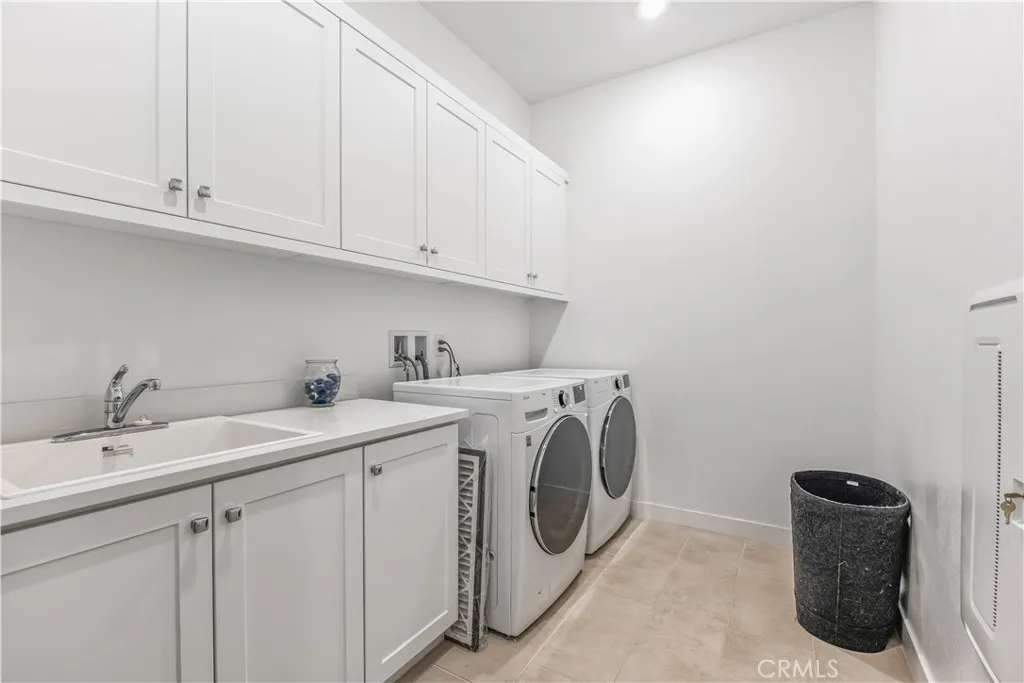 Spacious laundry room with sink