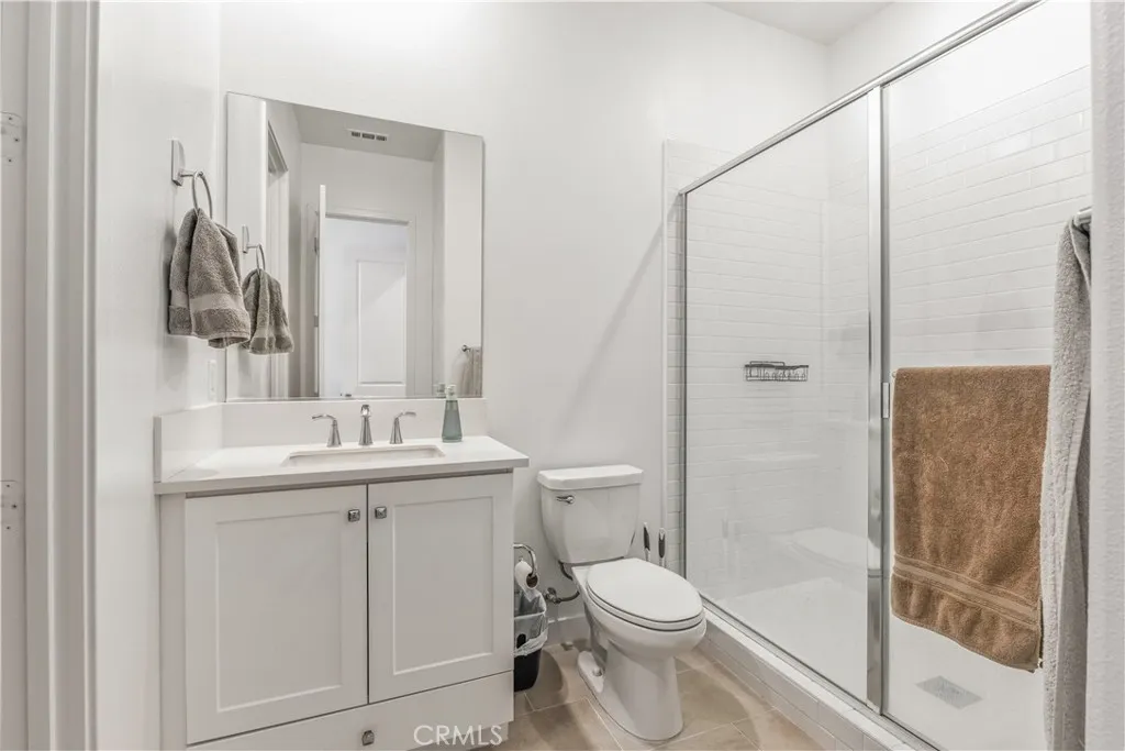 Secondary suite private bathroom with shower and walk-in closet
