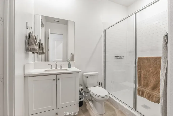 Secondary suite private bathroom with shower and walk-in closet