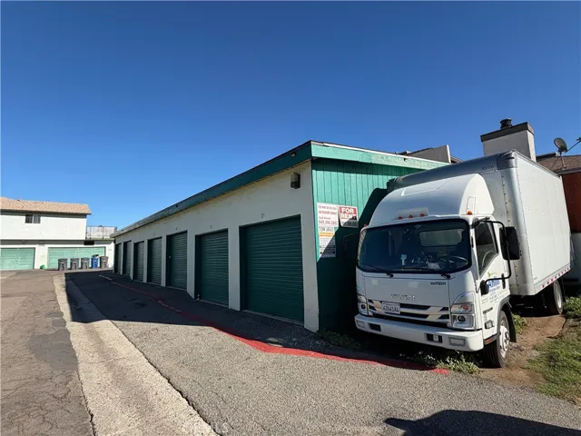 Storage units 15-21 with easy access, rented parking, and secure facility signage.