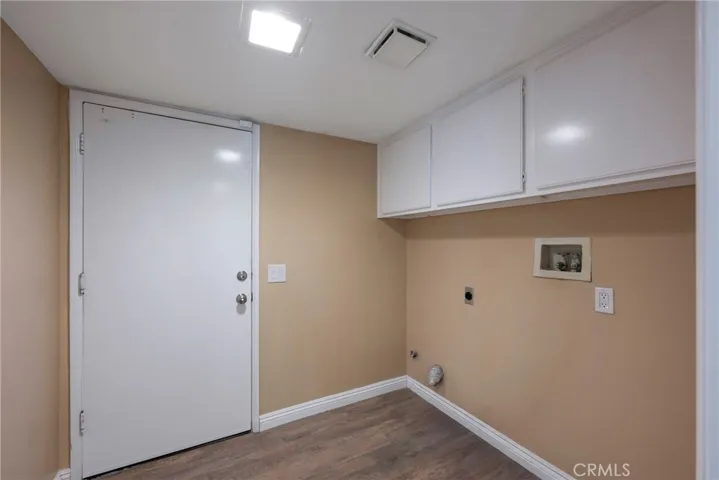 INSIDE LAUNDRY ROOM ACCESSIBLE TO HOME FROM 3 CAR GARAGE.