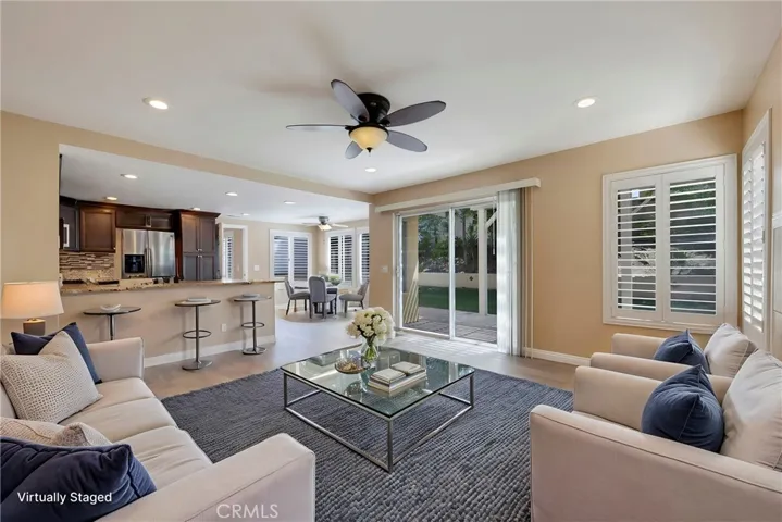 VIRTUALLY FURNISHED FAMILY ROOM OFF KITCHEN.