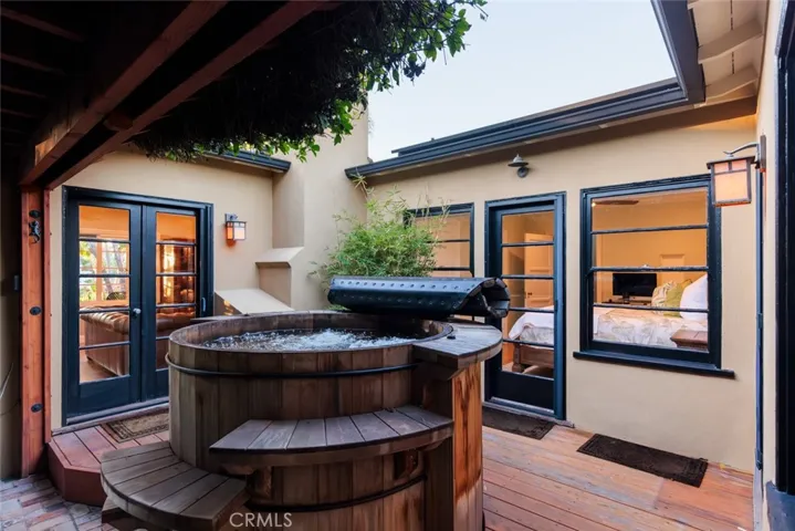 Secluded private deck with Japanese-style soaking hot tub. Spa day in your own side yard!