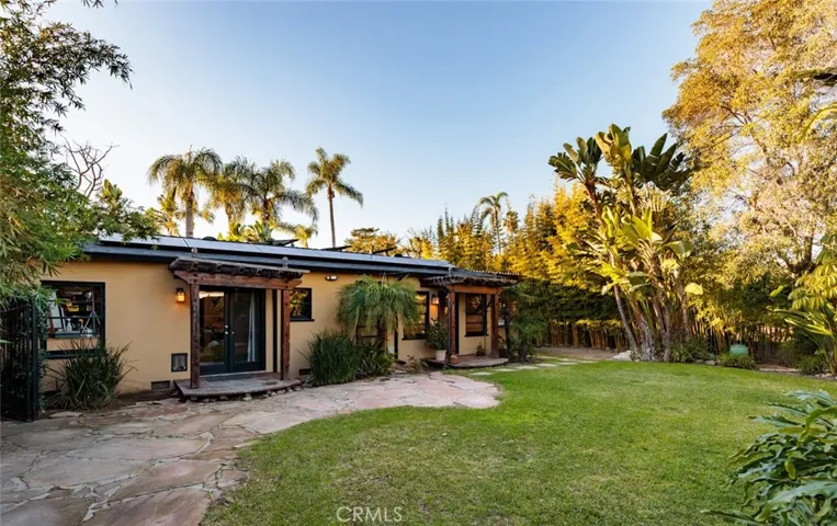 Back of the house & plentiful grass