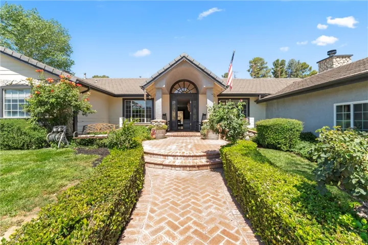 Brick Walkway leads you to front entry