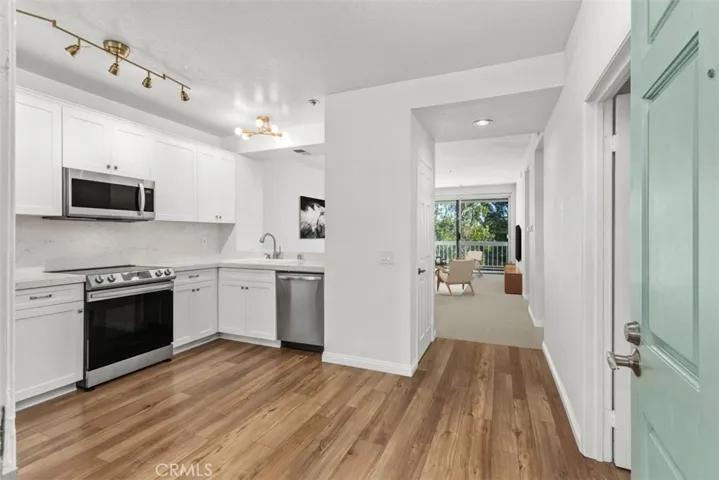 Newly upgraded Kitchen. Virtually staged living room.