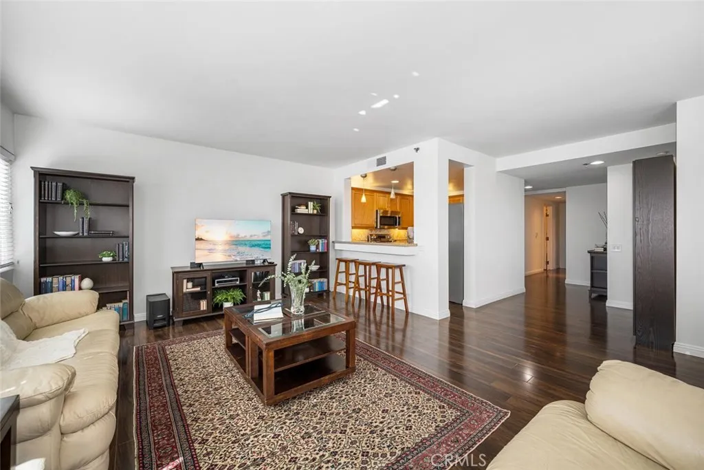 The inviting warmth of this beautiful flooring extends throughout the condo.