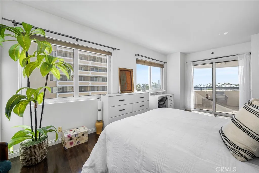 A generously sized master bedroom with direct access to two balconies. Enjoy coastal and ocean views from this vantage.