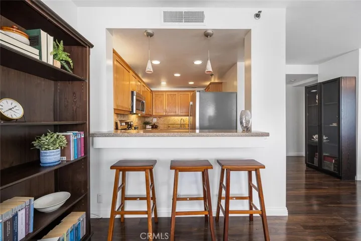 Grab a quick bite at the bar seating area next to your upgraded kitchen.