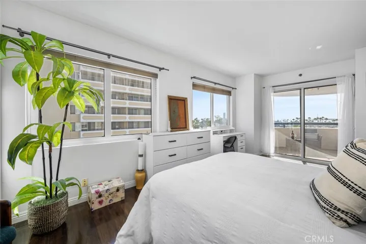 A generously sized master bedroom with direct access to two balconies. Enjoy coastal and ocean views from this vantage.