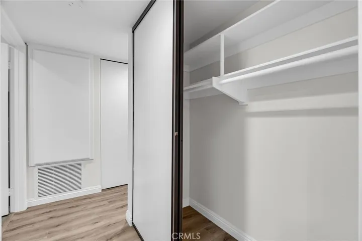 Hallway with 2 additional closets