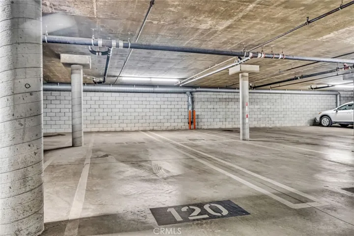 2 tandem covered/ gated parking spaces just off of the ground floor lobby