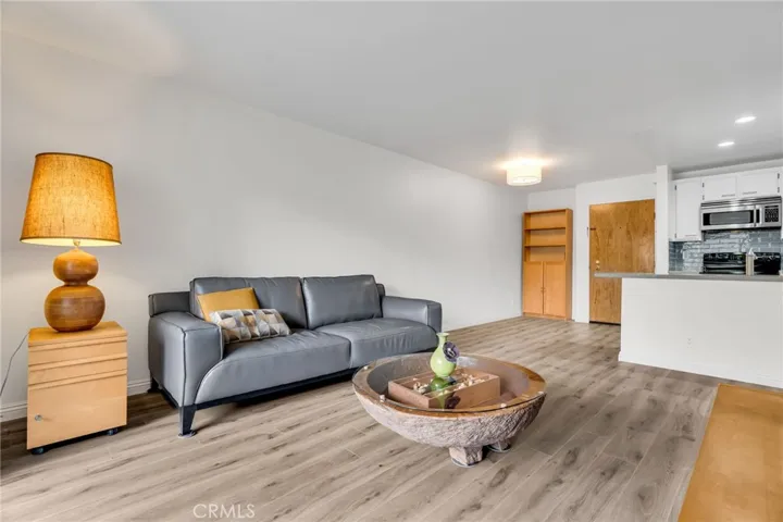 Spacious living room with adjacent dining area and open kitchen