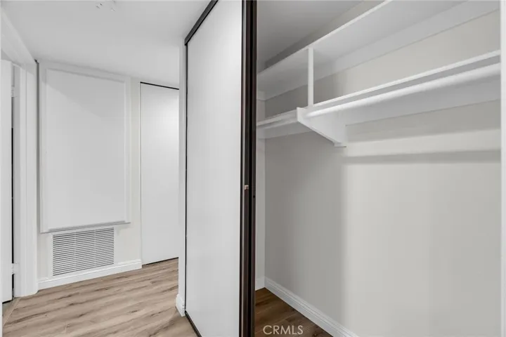 Hallway with 2 additional closets