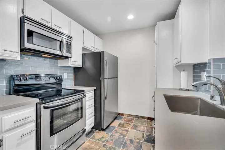 White cabinetry and stainless appliances for clean modern look