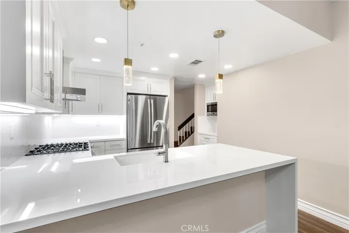 The kitchen has plenty of countertop space and cabinety space for storage.