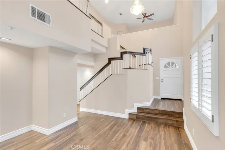 The living room has vaulted ceilings approximately 20 feet high.