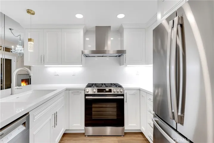 The brand new kitchen has a Bosch stove, Bosch dishwasher and a GE fridge.