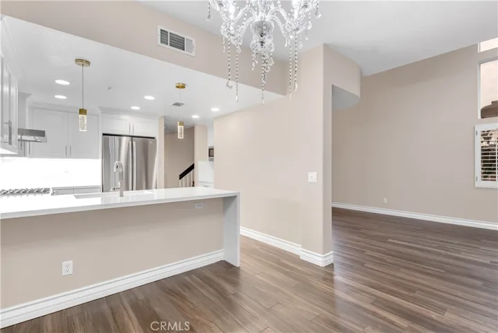 Another view of the dining room, kitchen and living room area.