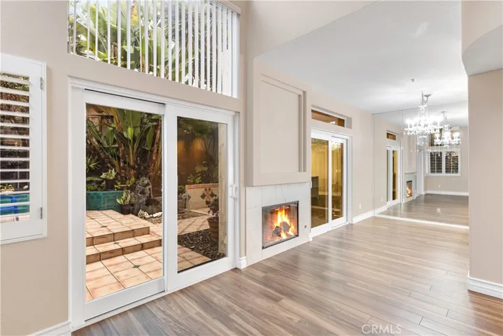 The living room as well as the dining room have dual pane sliding glass doors leading to your backyard.