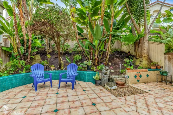 The backyard is professionally maintained by the landlord's gardener.