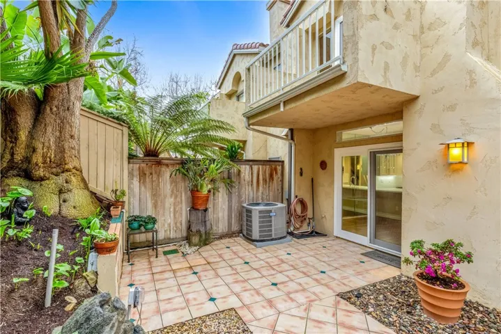 The backyard also has AC as well as large patio seating areas.