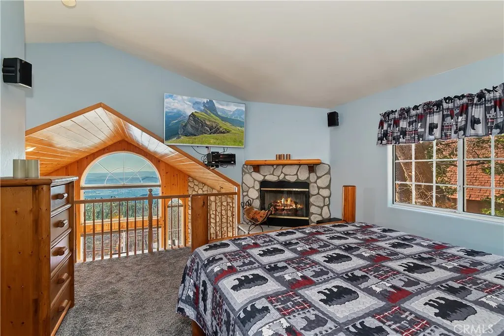 Top Level Primary Bedroom

Fire in fireplace has been digitally added